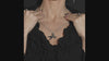 video of a gothic woman wearing a whimsical dark gothic horror scissors necklace