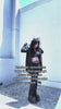 gothic woman wearing a bat sleeve hoodie