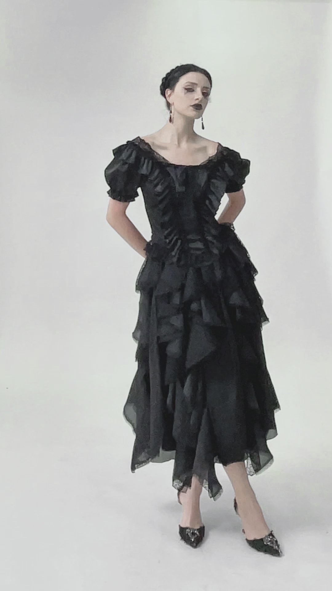 video of gothic woman wearing gothic lolita top