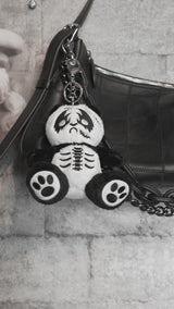 video of a stuffed animal heavy metal panda bear keychain