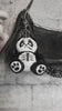 video of a stuffed animal heavy metal panda bear keychain
