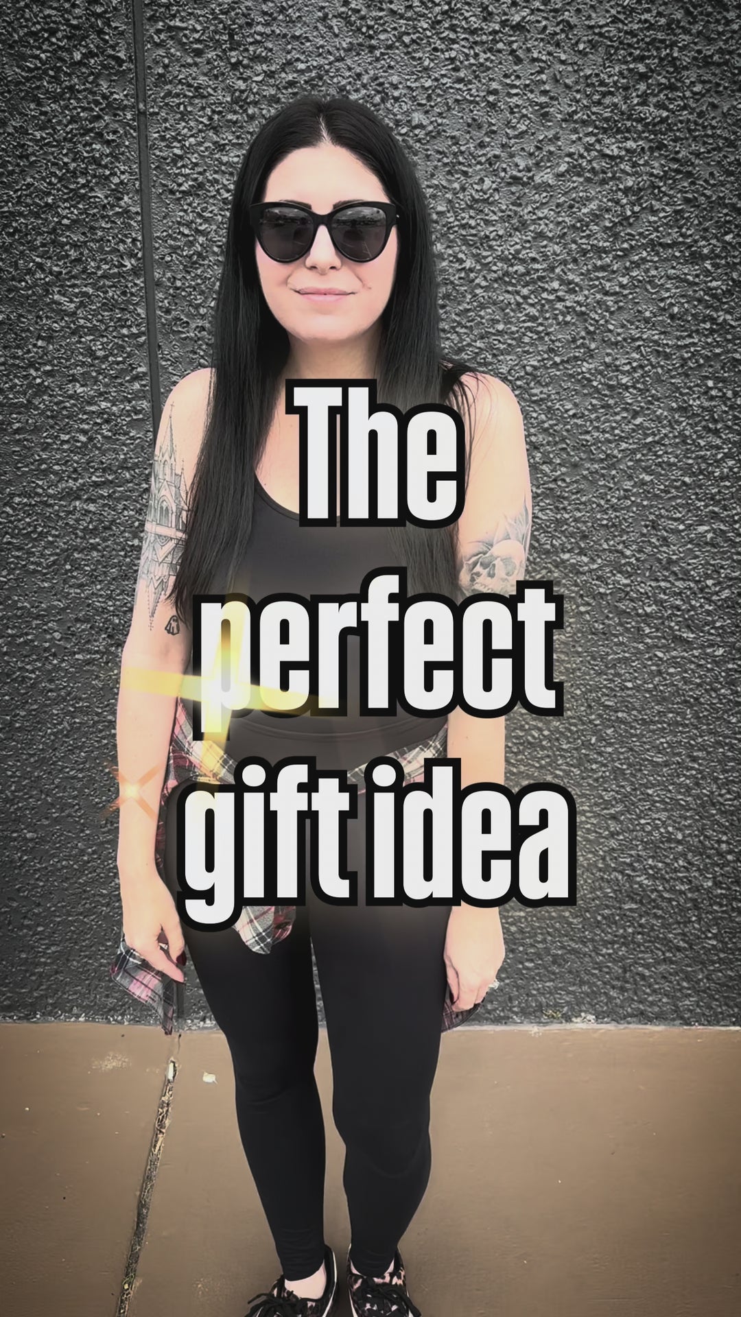 video of a gothic woman wearing vampire bat jogger pants, a medieval goth sweatshirt, and holding a raven tote bag