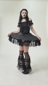goth woman wearing a short unique quirky weird girl skirt 