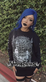 video of a blue-haired gothic woman wearing a ghost sweatshirt by vampirefreaks 