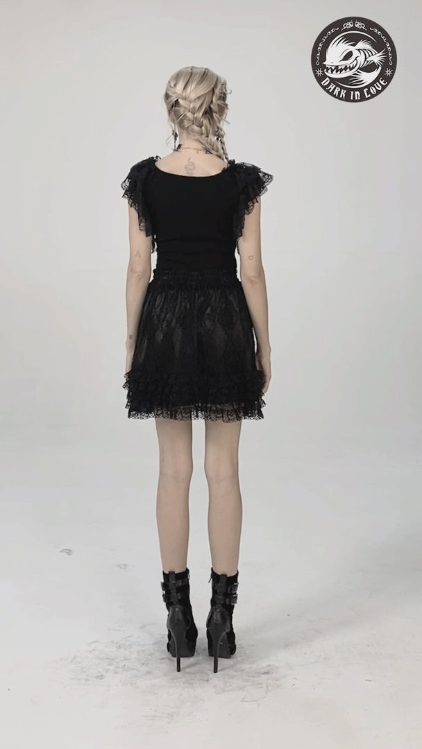 video of a gothic woman wearing a gothic lace shirt