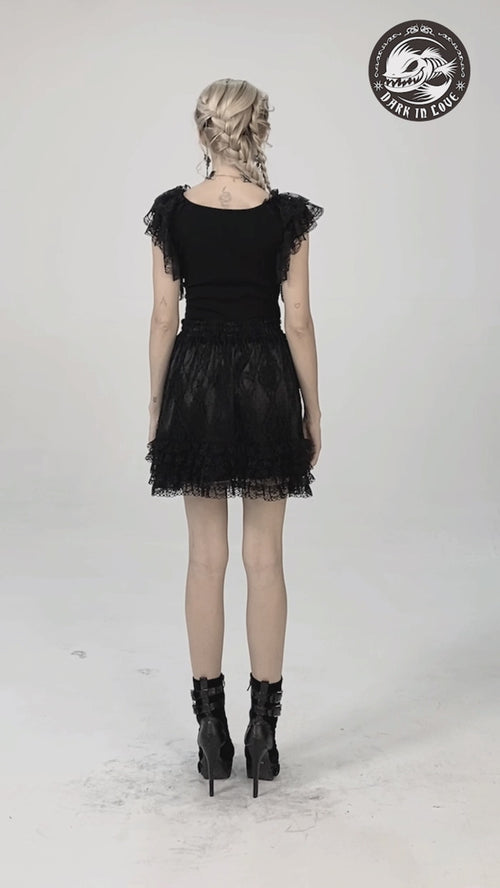 video of a gothic woman wearing a gothic lace shirt