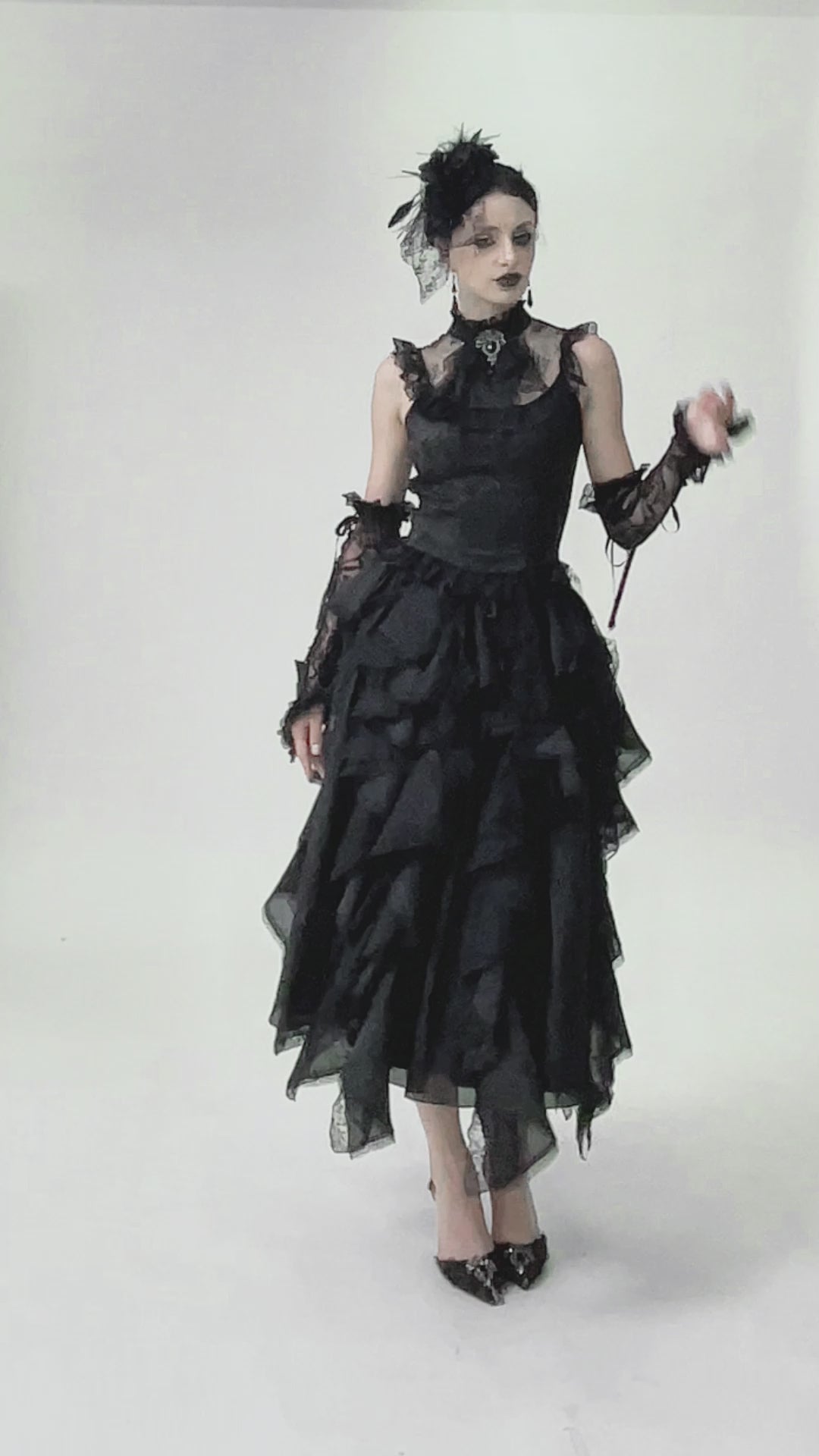 video of a gothic woman wearing a Victorian gothic sexy ruffled hem damask tank top