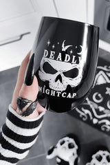 gothic woman holding a punk stemless skull drinking glass