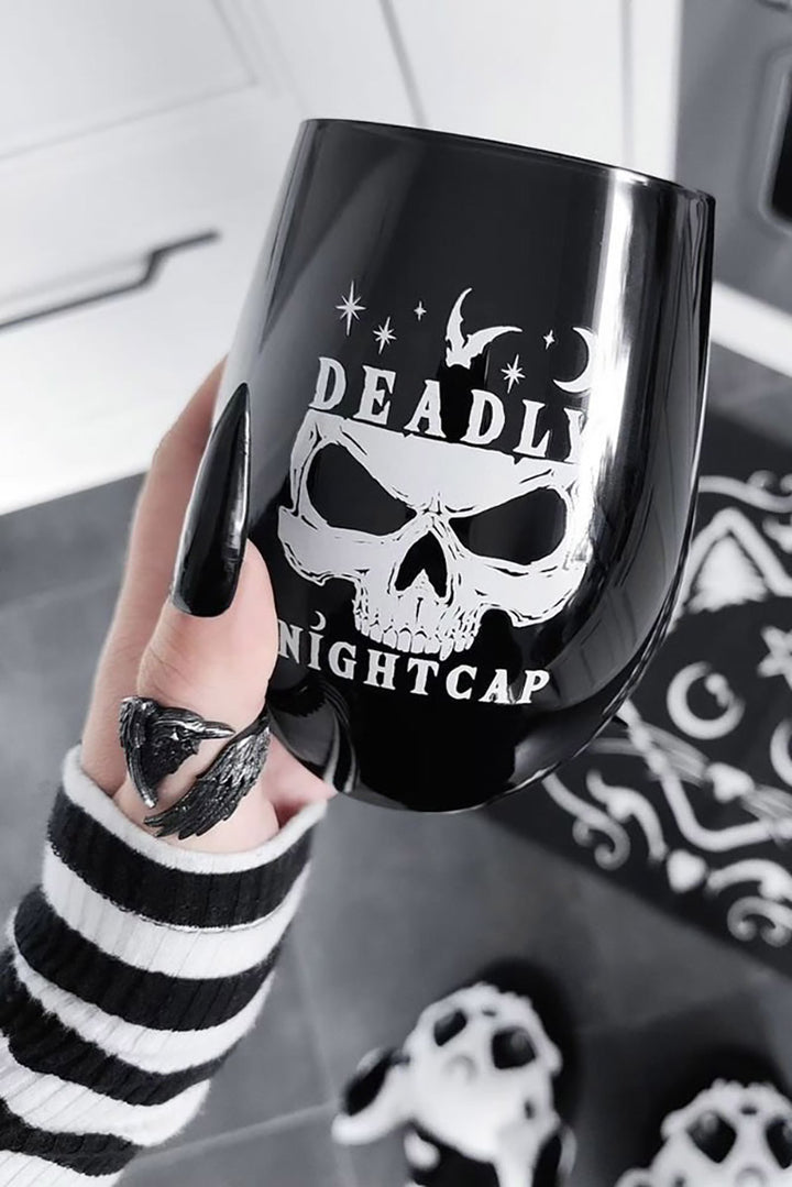 gothic woman holding a punk stemless skull drinking glass