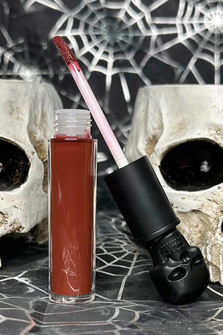 gothic lip gloss with skull shaped bottle