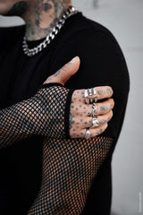 mens short sleeve black shirt layered over fishnet top