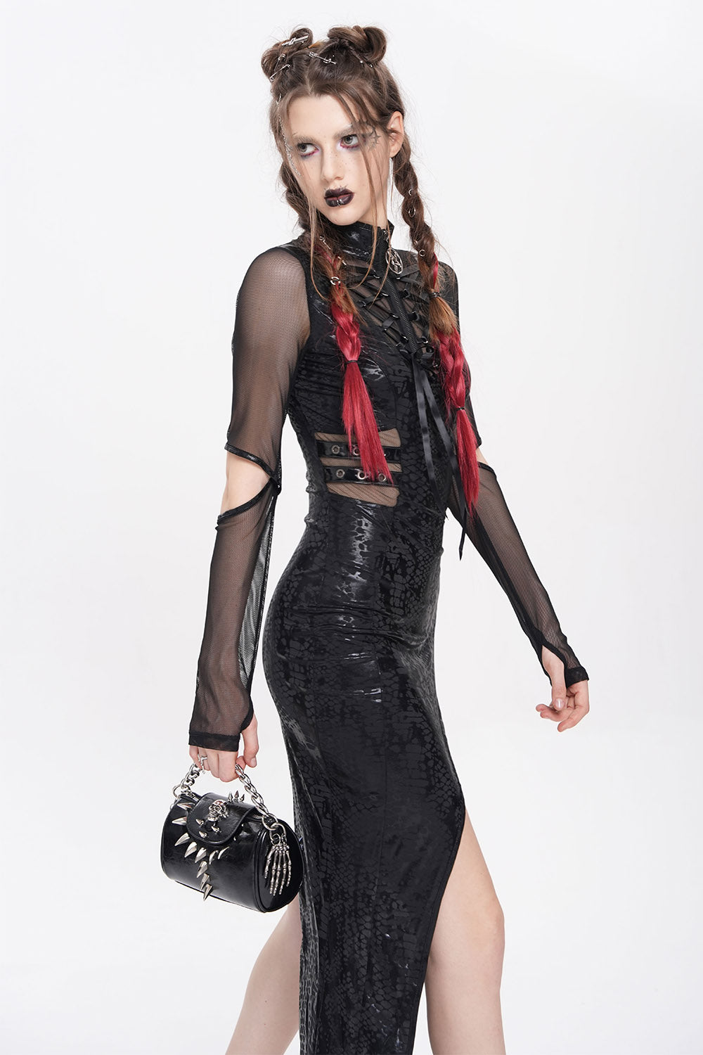 black small bag with spikes and skeleton hand charm