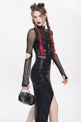 black small bag with spikes and skeleton hand charm