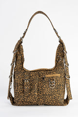 Leopard print handbag with shoulder strap on a white background