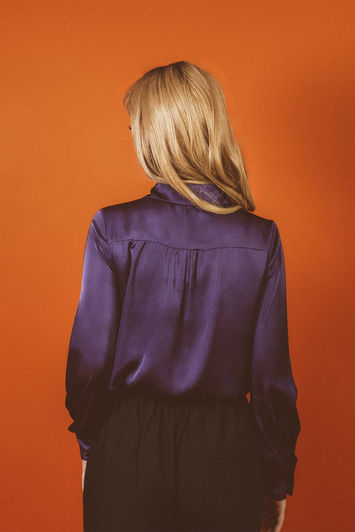 womens witchy deep rich purple satin button up collared shirt with cuffs and billowy sleeves