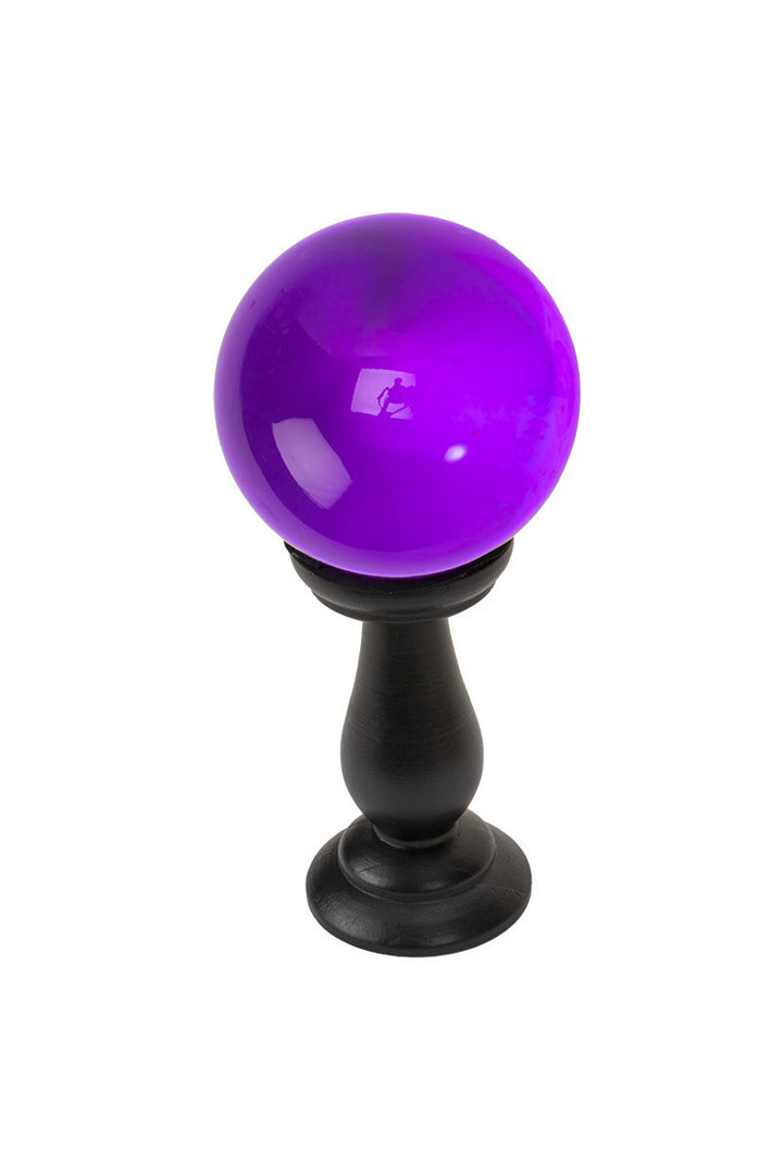 purple crystal ball with a black stand 