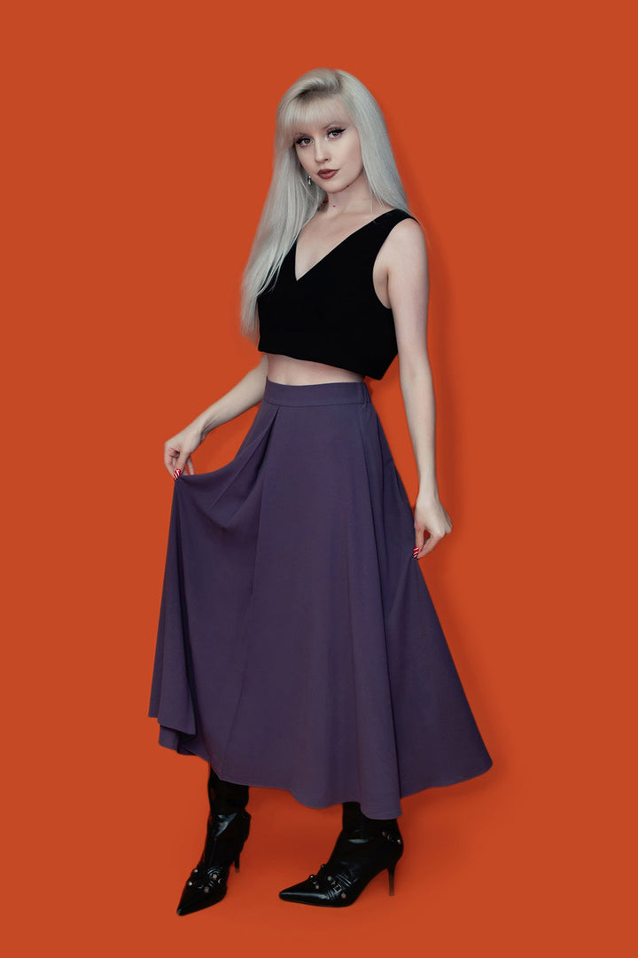 high-waisted flowing purple midi length skirt