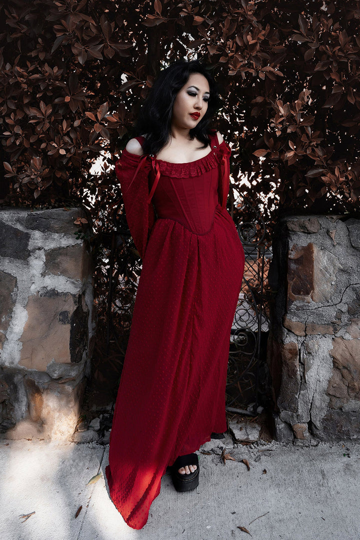 maxi length dark red dress with a red corset
