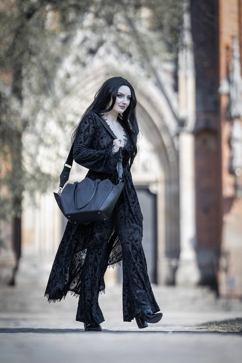 restyle gothic cathedral shoulder bag with detachable shoulder strap and with red interior lining 