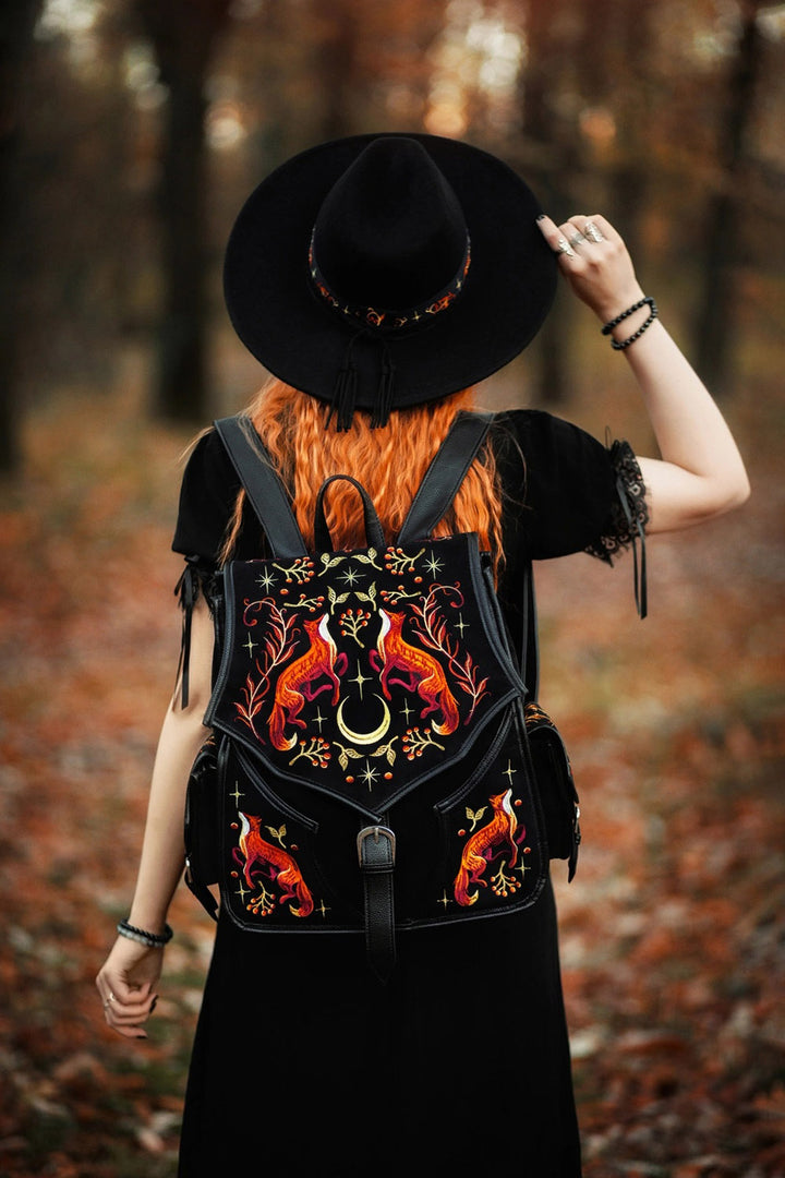 embroidered whimsical backpack with vegan leather strips 