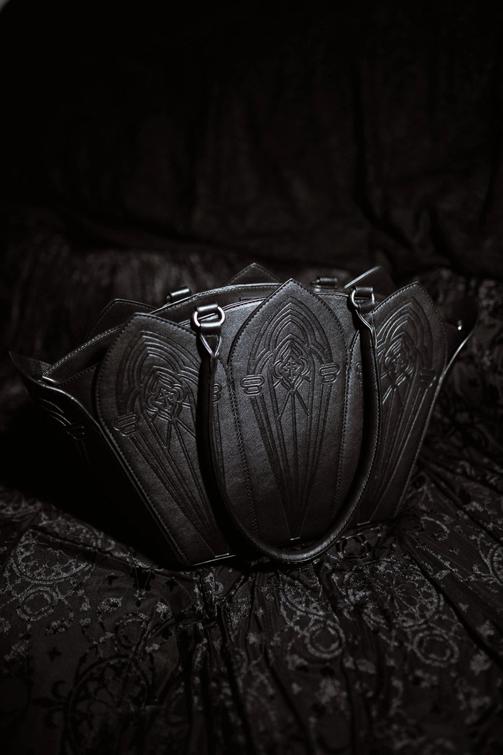 gothic cathedral shoulder bag with detachable shoulder strap and with red interior lining 