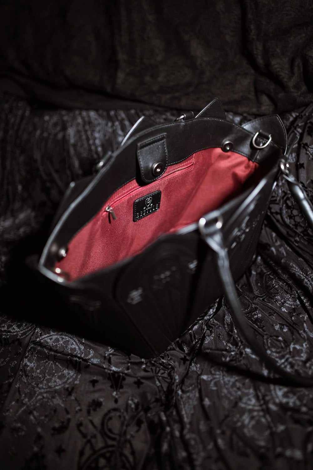 vegan gothic cathedral shoulder bag with detachable shoulder strap and with red interior lining 