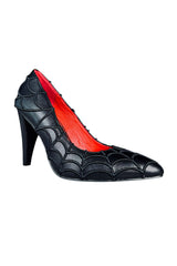 Black high-heeled shoe with spider web design and red interior on a white background
