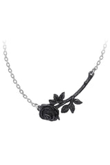 Black rose necklace on a white chain against a white background