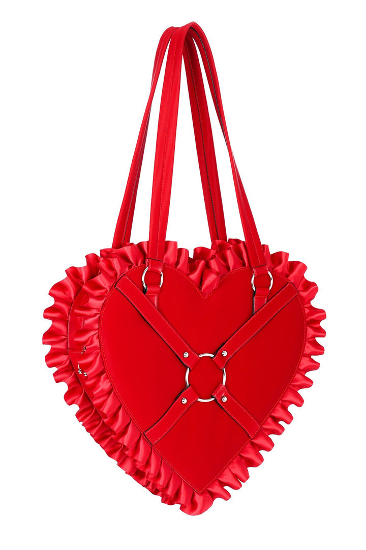 Red heart-shaped handbag with ruffled details on a white background
