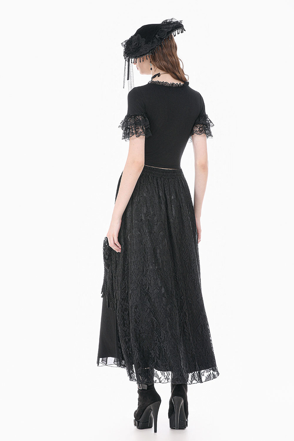 Back view of model wearing black top with lace short sleeves