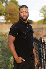 Mens gothic black button up shirt with buckle shoulder straps and chest pockets for punk rock style industrial goth and edgy outfits