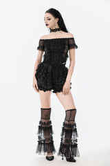 Model wearing goth fashion ruffle shorts
