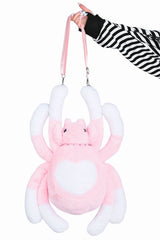Pink spider themed sling bag with gothic details for pastel goth punk and grunge inspired outfits