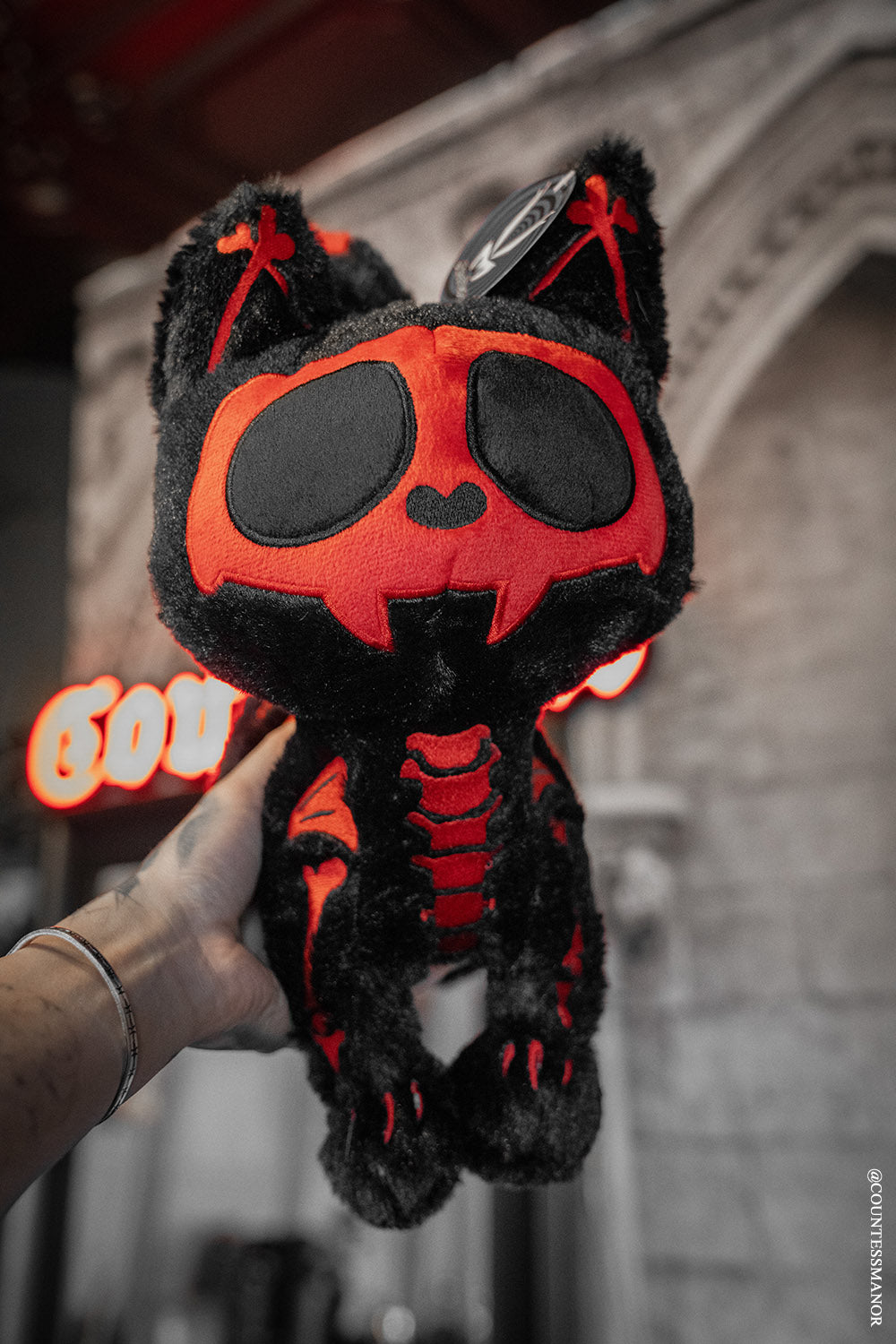 black and red skeleton cat plushie