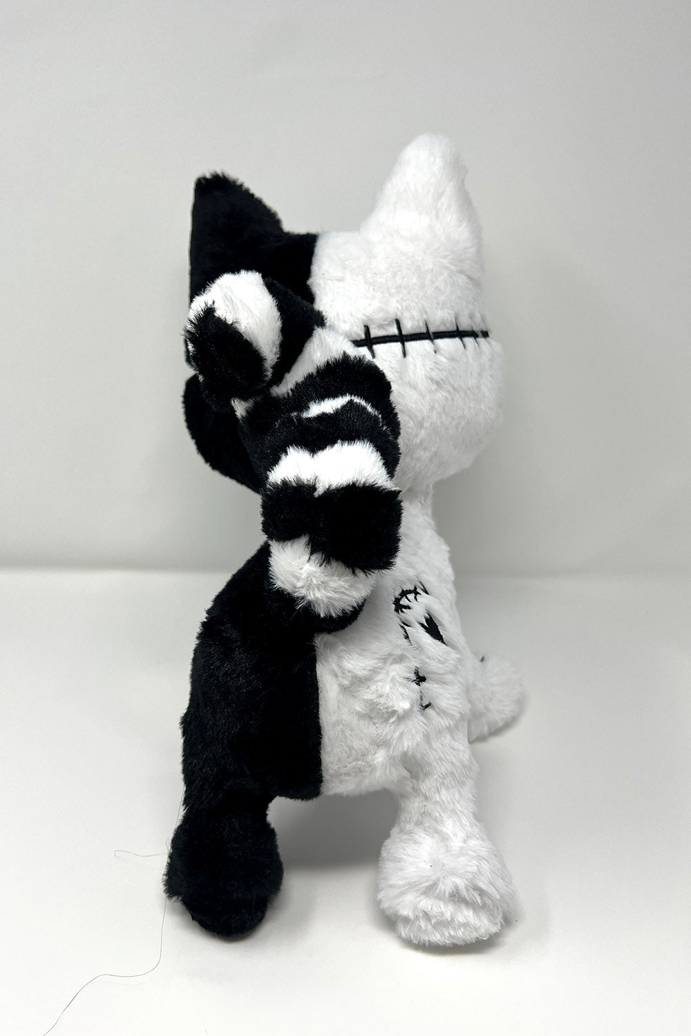 gothic skeleton cat plushie with stitches spiral tail