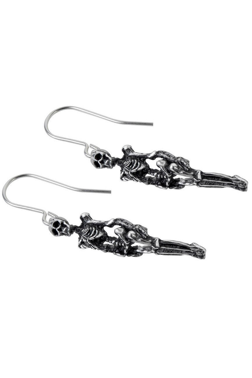 Pair of silver skeleton pewter earrings on a white background