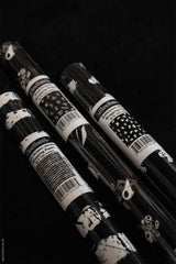 black and white striped wrapping paper and ghost wrapping paper and a roll of Skeleton animal gift wrap