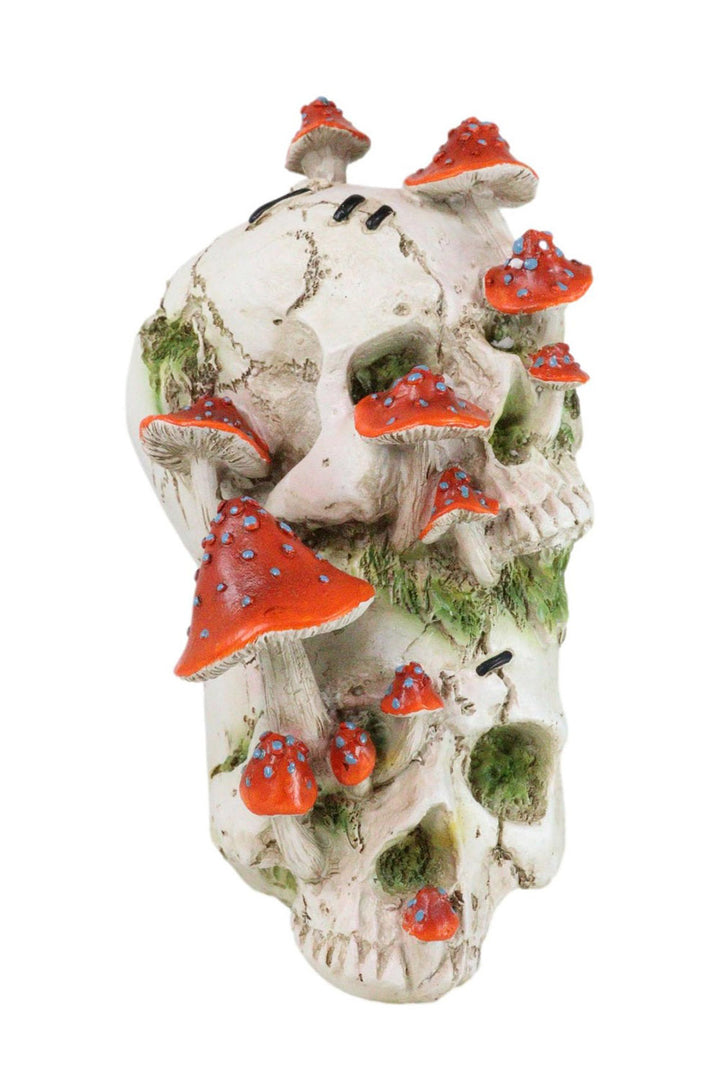dark cottagecore skull and mushroom statue