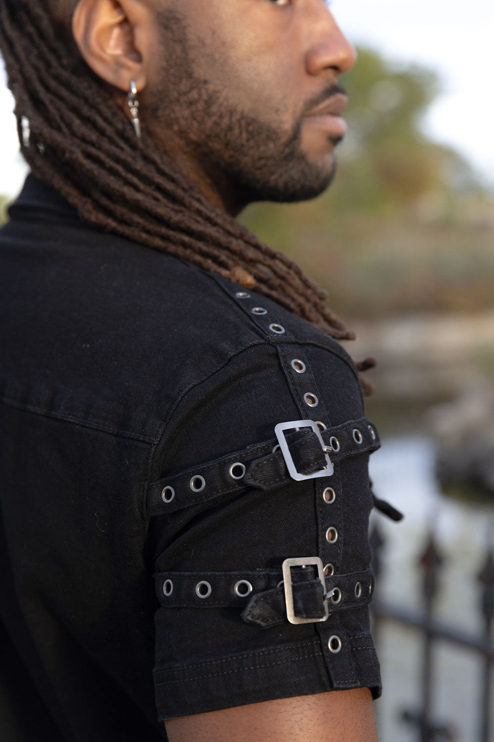 Gothic short sleeve shirt for men featuring shoulder strap buckles and chest pockets for emo grunge style and dark alternative clothing