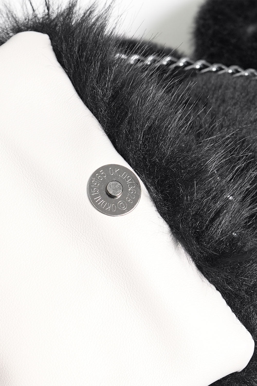 Backpack button closure
