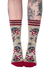 black cat wearing mushroom hat socks