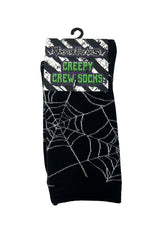 Packaged black spider web socks with 'Creepy Crew Socks' packaging text on a white background