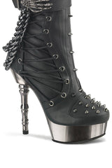 skeleton had buckle boots with chains and studs
