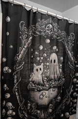 Decorative shower curtain with ghost and cat design on a black background