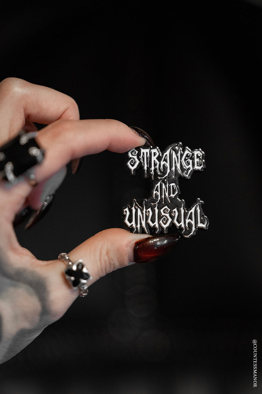 Strange and Unusual Enamel Pin