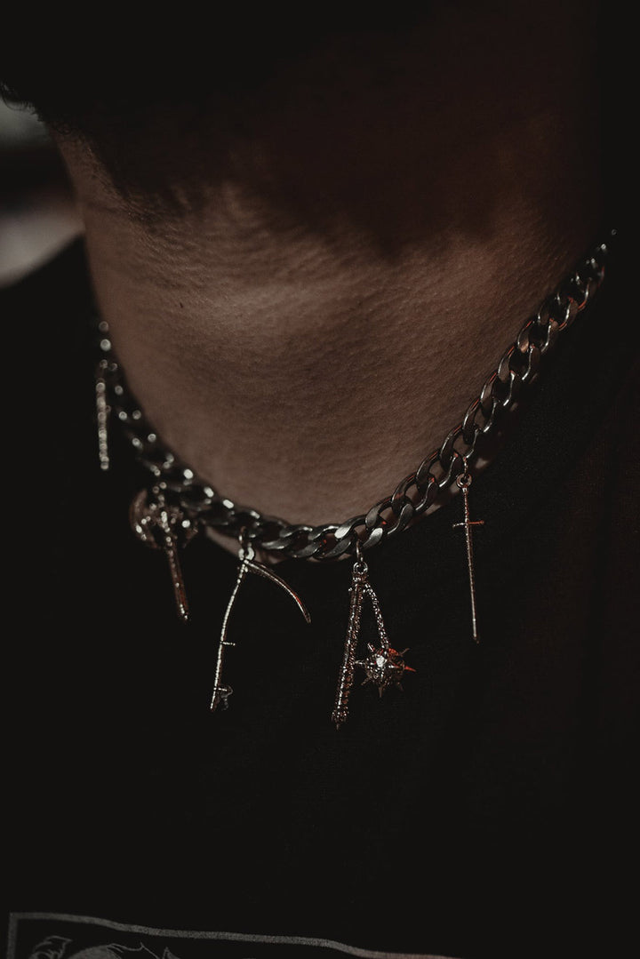 silver weapons necklace