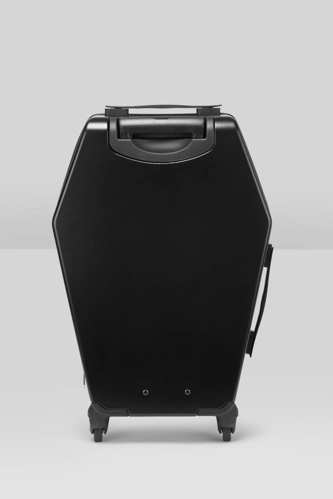 black travel sized coffin shaped luggage