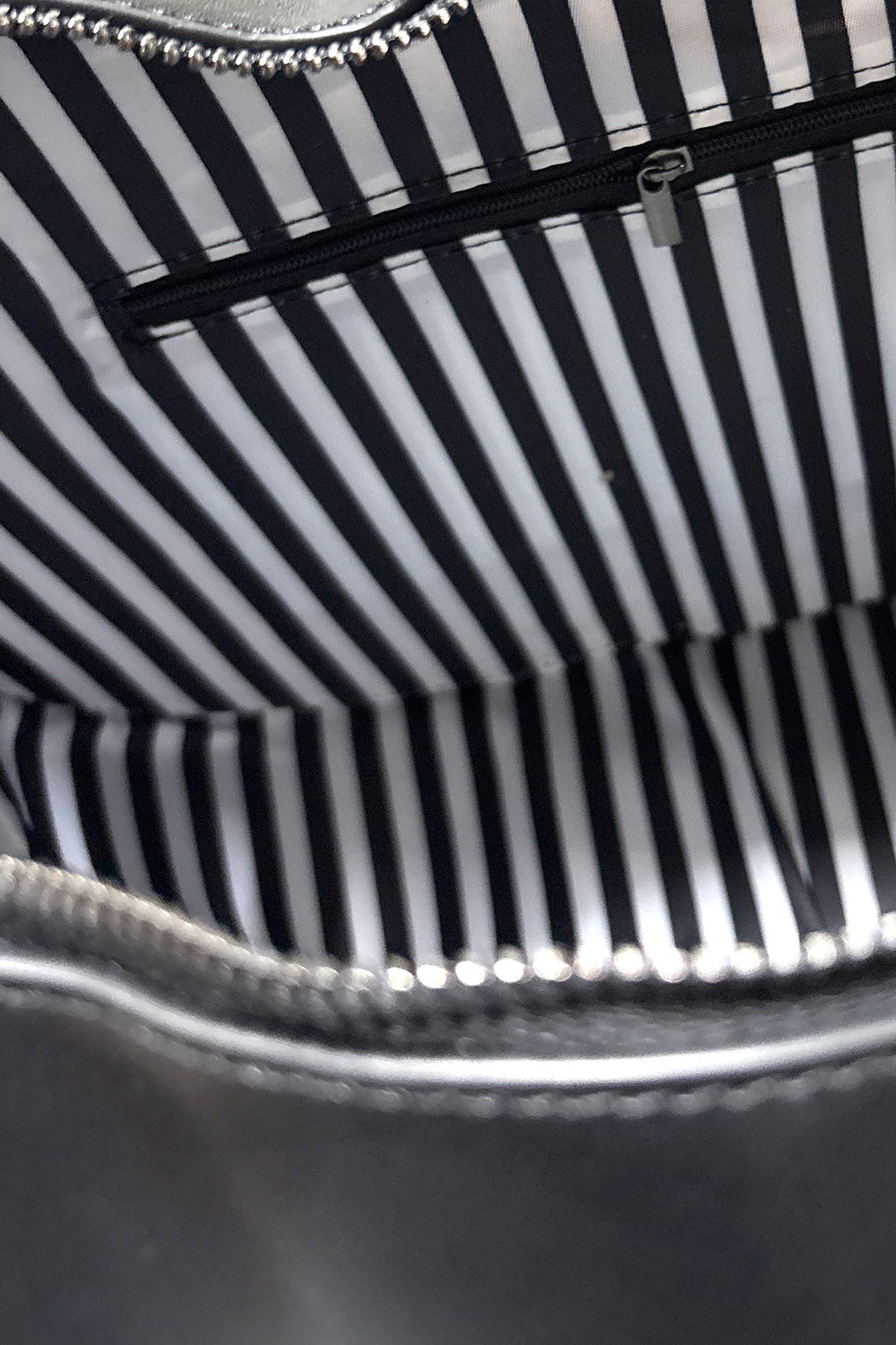 black and white interior inside lining of a moth backpack