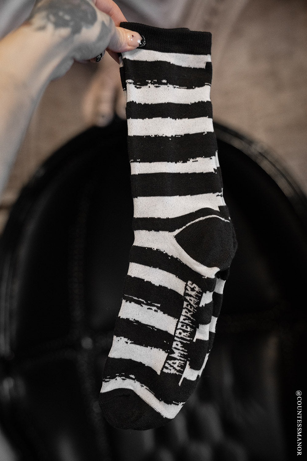 distressed black and white striped socks