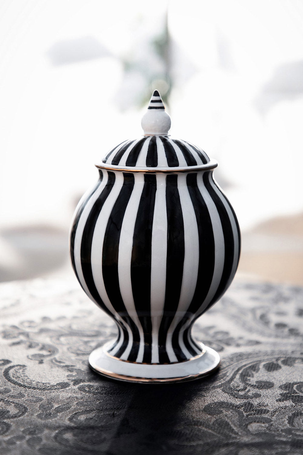 black and white striped sugar jar